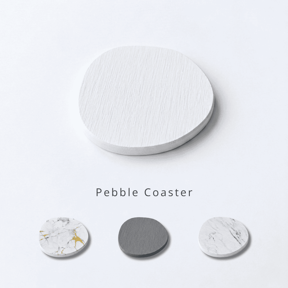 Pebble coasters in various designs on a light gray background