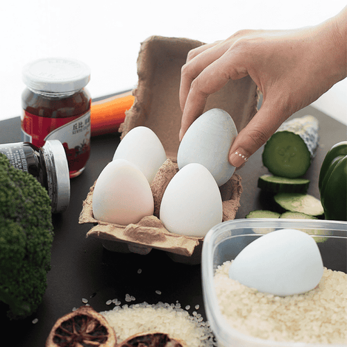 Diatomite Dehumidifying Eggs in a carton and in a container filled with rice