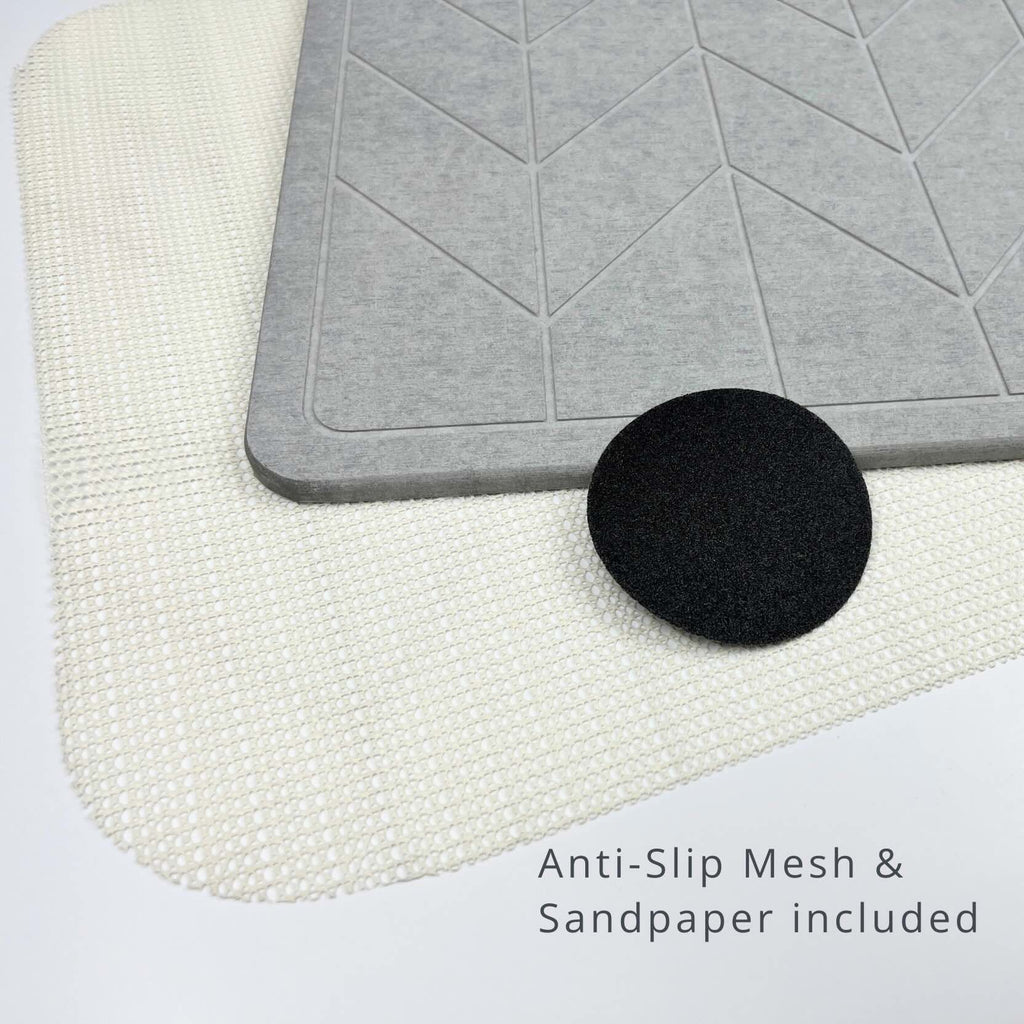 Grey textured diatomite stone mat on an anti-slip mesh, and sandpaper with text 'Anti-Slip Mesh & Sandpaper included'.