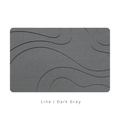 Dark Grey diatomite bath mat with a line-patterned engraving on White background with text 'Line Dark Grey'