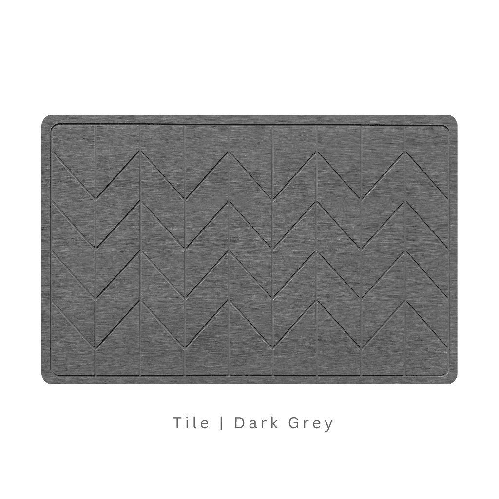 Dark Grey diatomite bath mat with a tile-patterned engraving on white background with text 'Tile Dark Grey'
