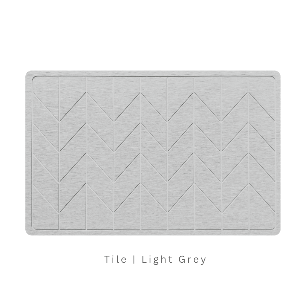 Light Grey diatomite bath mat with a tile-patterned engraving on white background with text 'Tile Light Grey'